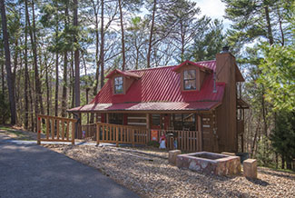 Pigeon Forge Two Bedroom Pet Friendly Cabin Rental that has a multi-game table Hot Tub Outdoor Fireplace